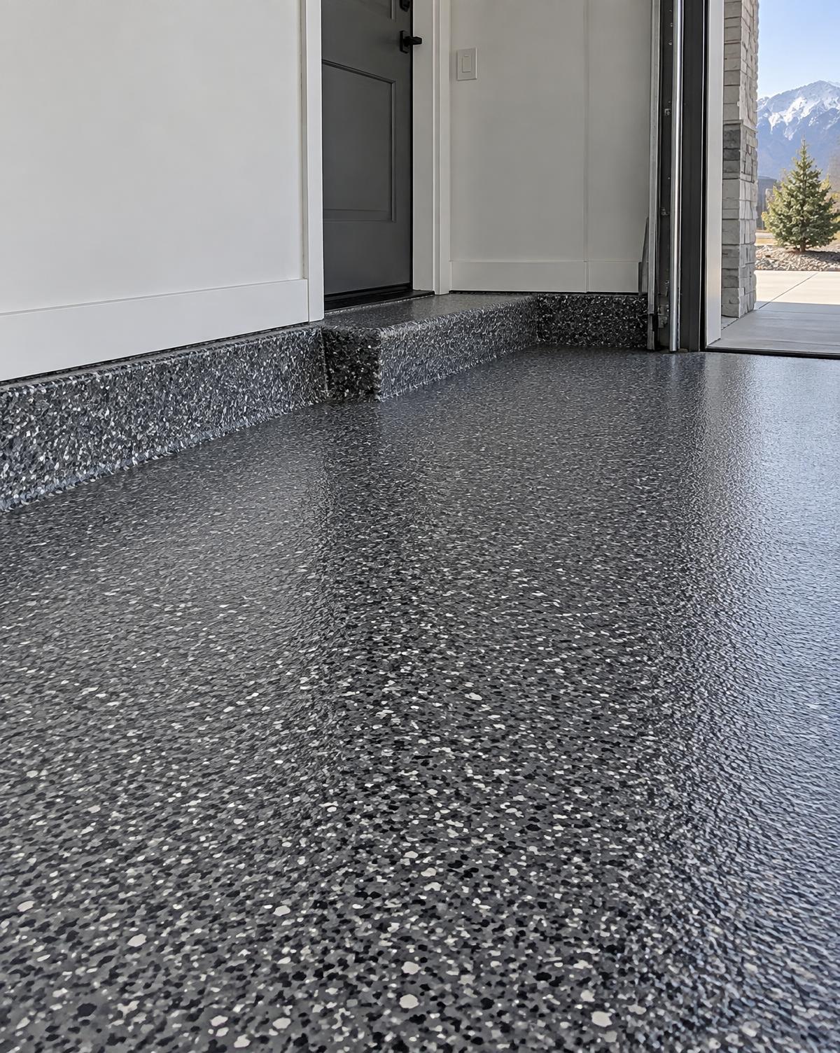 Sharp close-up of a coated garage floor edge and step